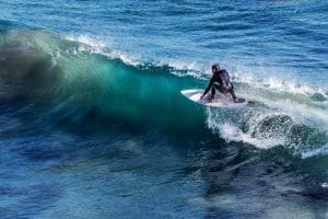 Male surfer riding a wave.