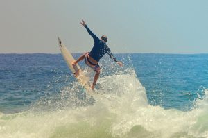 Surfer wears rashguard as ocean-safe sun-protection